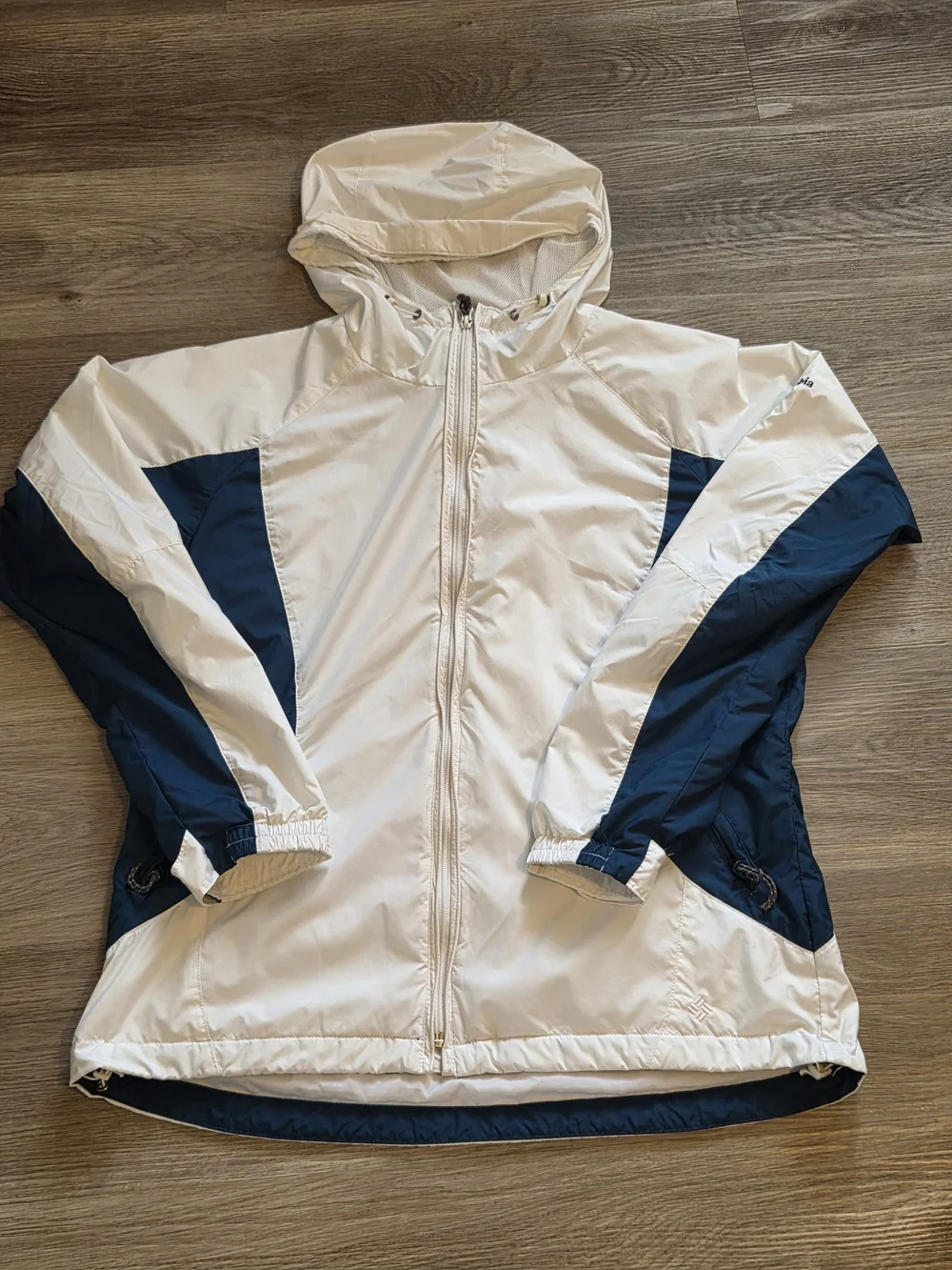 Columbia This jacket is a white and navy blue Columbia windbreaker